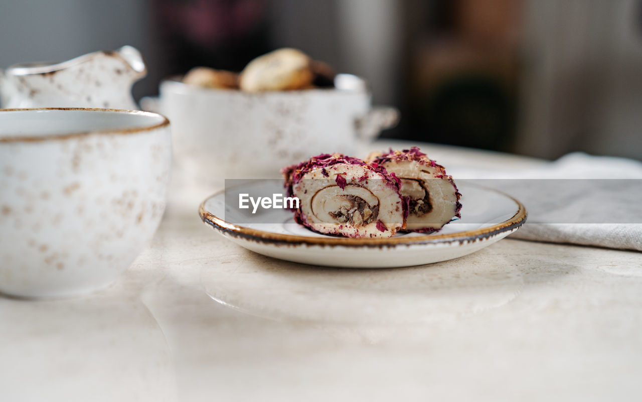 Turkish delight with nuts covered rose leaves. food and drink concept