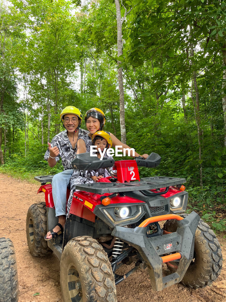all-terrain vehicle, transportation, off-roading, men, adult, mode of transportation, tree, two people, togetherness, leisure activity, portrait, motorsport, vehicle, plant, smiling, sports, happiness, racing, looking at camera, women, nature, day, emotion, sitting, helmet, headwear, sports helmet, young adult, bonding, adventure, riding, driving, full length, wheel, fun, travel, enjoyment, outdoors, front view, land vehicle, lifestyles, soil, casual clothing, land, person, rural scene, forest, female, trip, crash helmet, vacation, motorcycle, cheerful, holiday, friendship, landscape, recreation