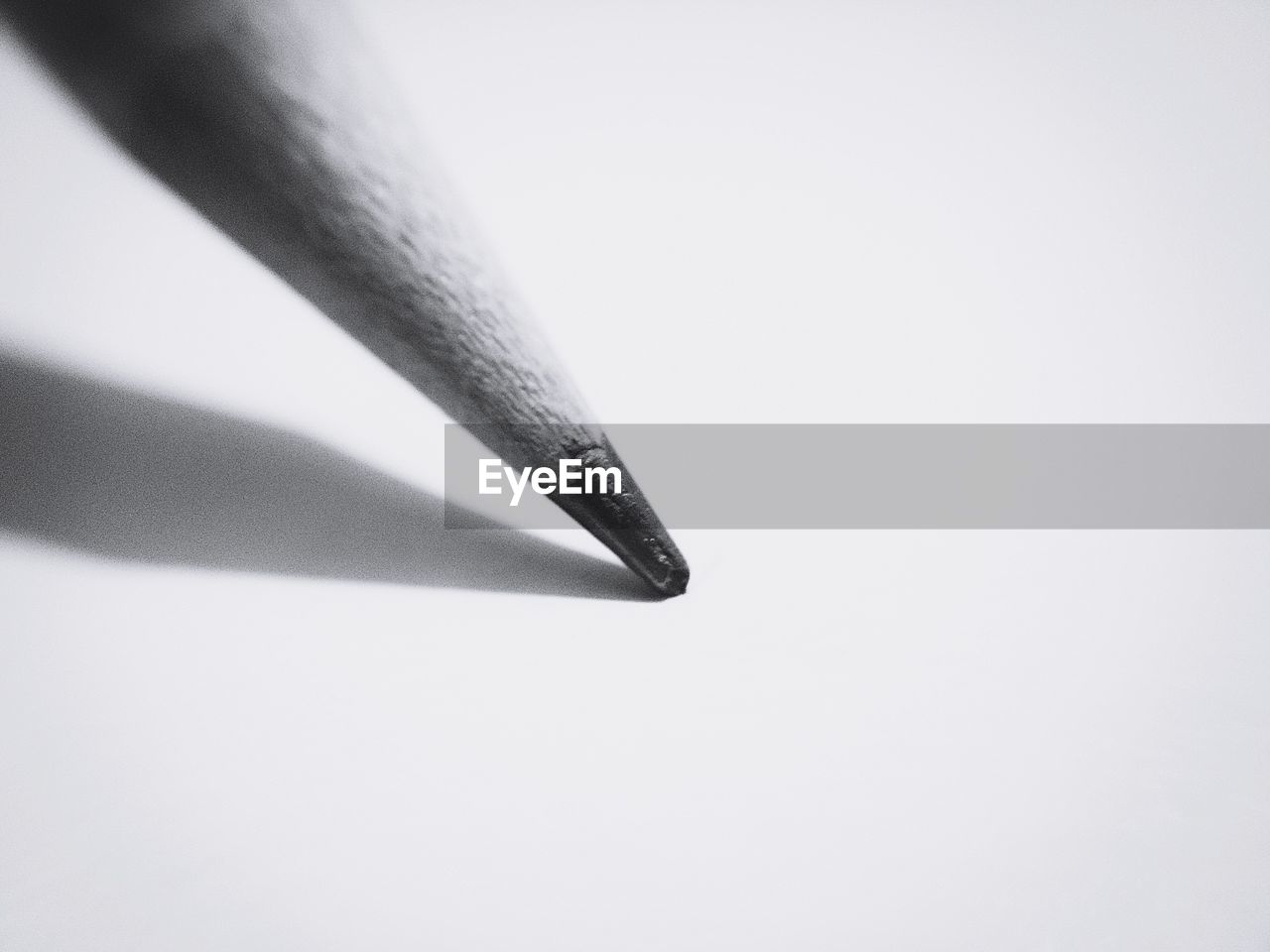 CLOSE-UP OF CIGARETTE AGAINST WHITE BACKGROUND