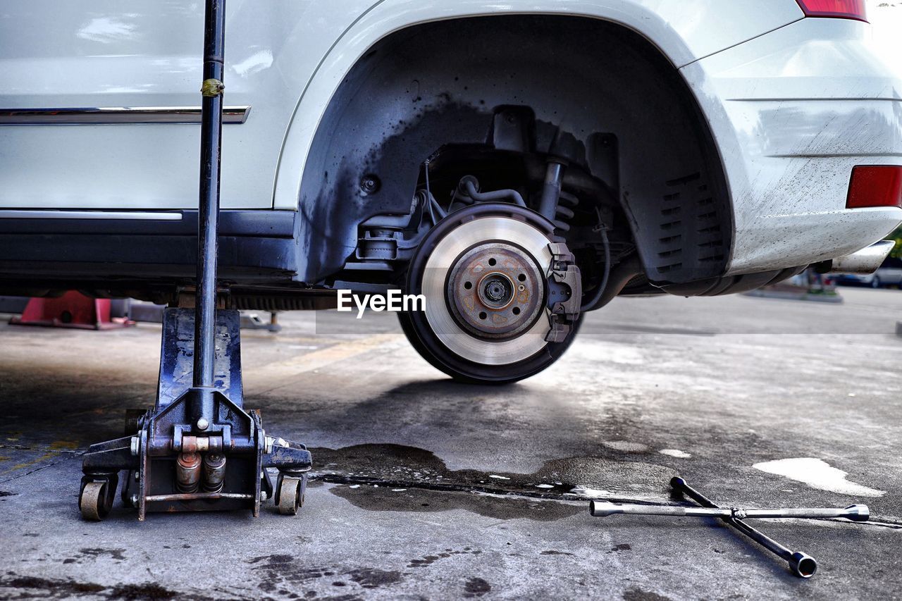 Close-up of car brake disc at garage