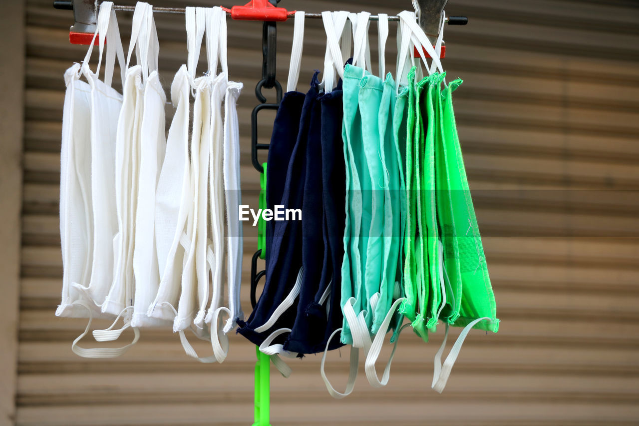 Close-up of clothes hanging on rack