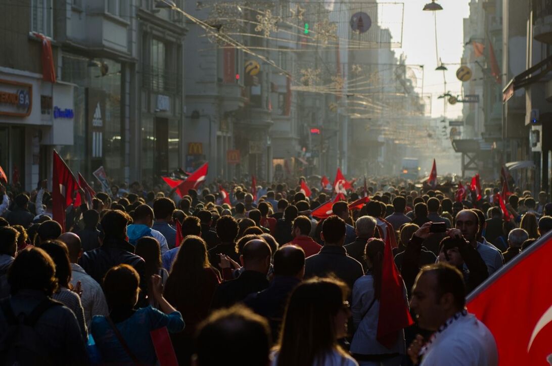 Large group of people on road at istiklal caddesi