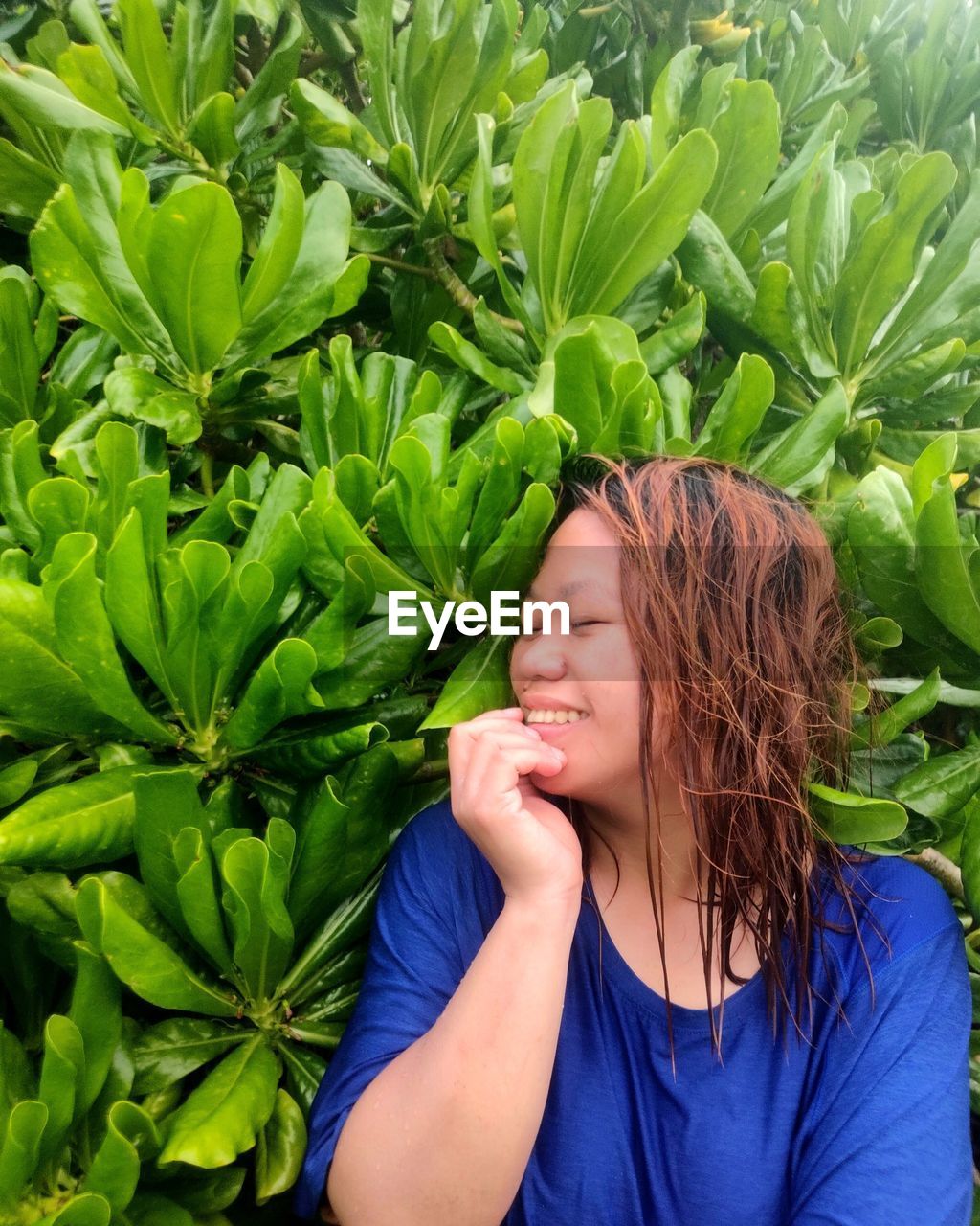 one person, plant, green, women, growth, adult, nature, flower, leaf, food and drink, food, plant part, smiling, portrait, young adult, lifestyles, happiness, eyes closed, emotion, hairstyle, grass, leisure activity, headshot, agriculture, freshness, long hair, wellbeing, brown hair, outdoors, day, healthy eating, casual clothing, crop, tree, looking, female, front view, enjoyment, child, garden, waist up, environment, produce, beauty in nature