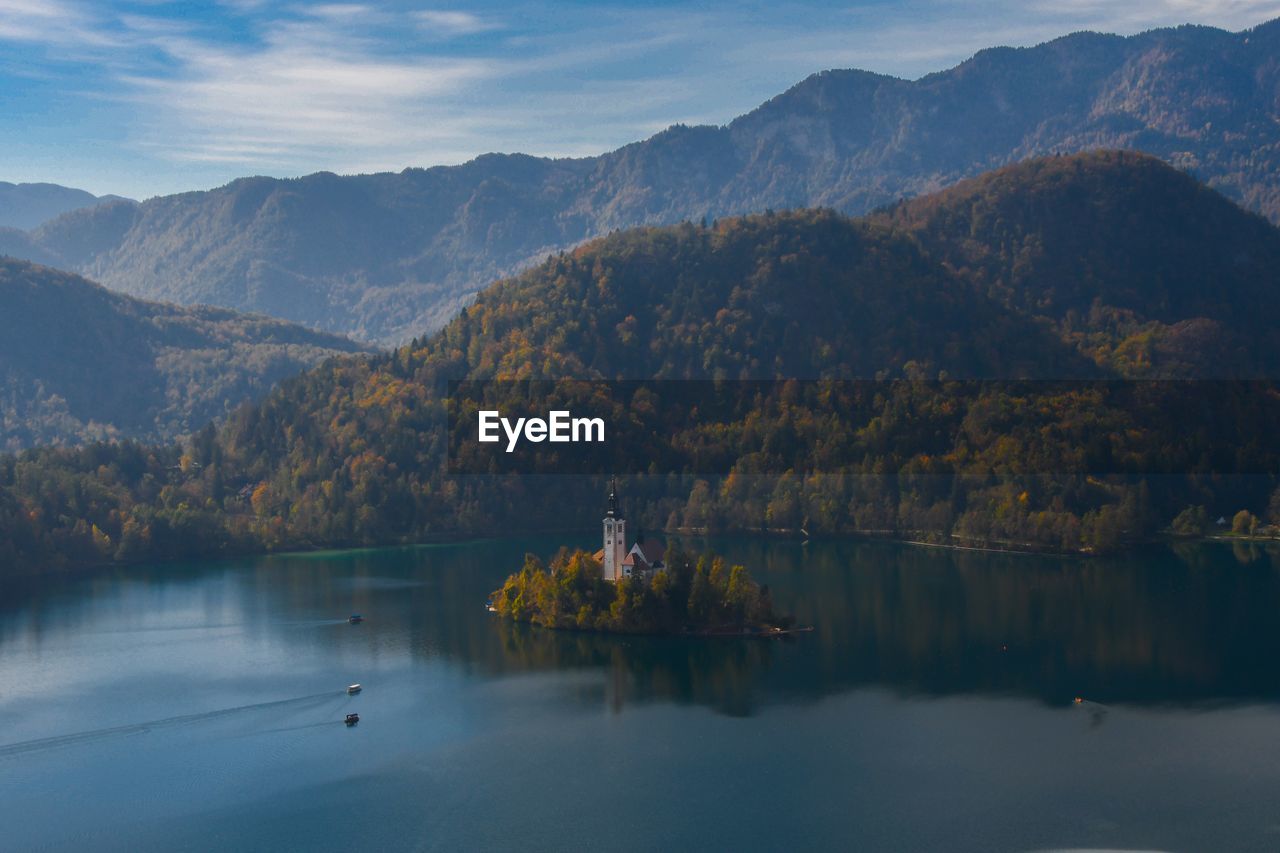 Scenic view of lake and mountains against sky