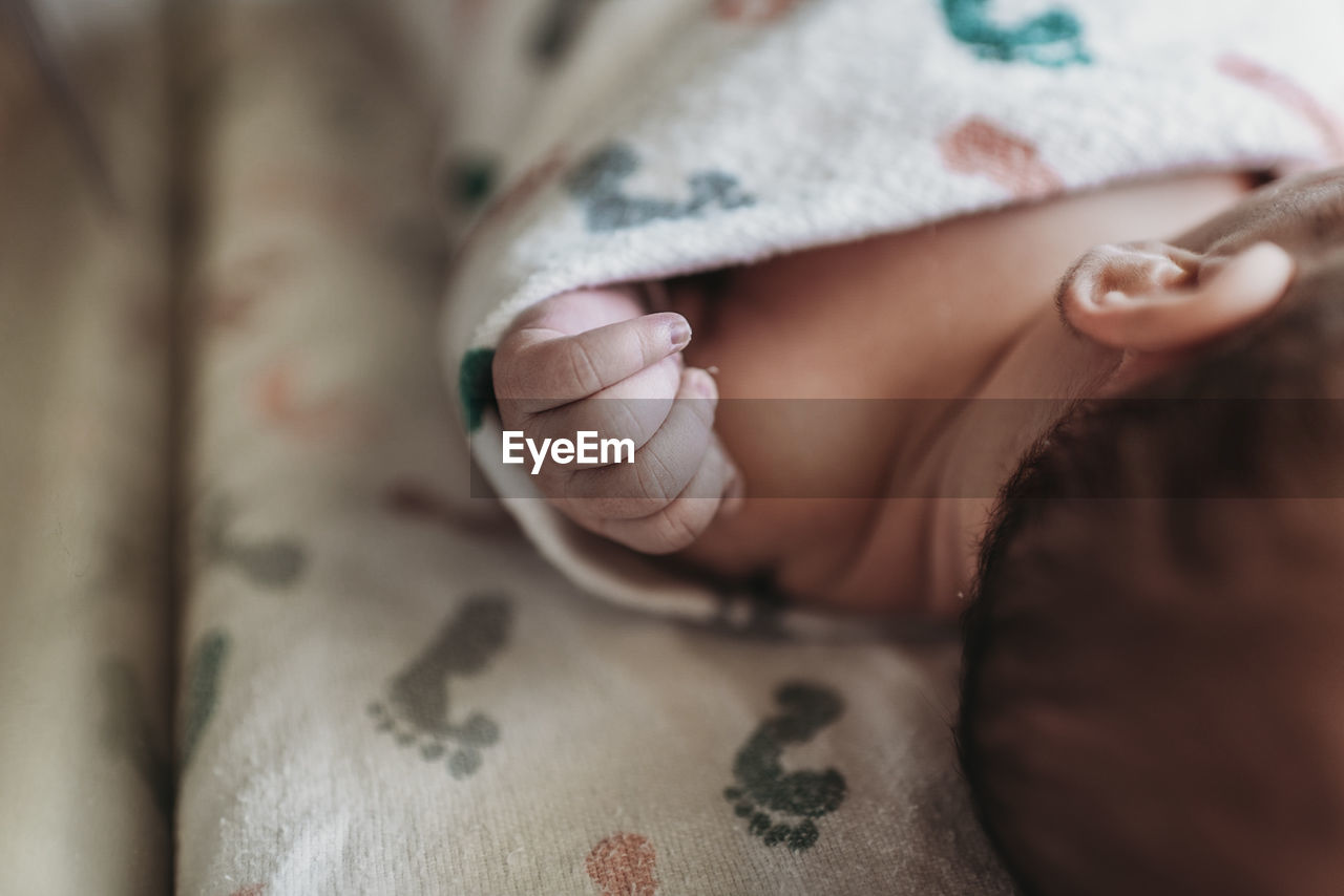 Close up detail of newborn boy hand in hospital