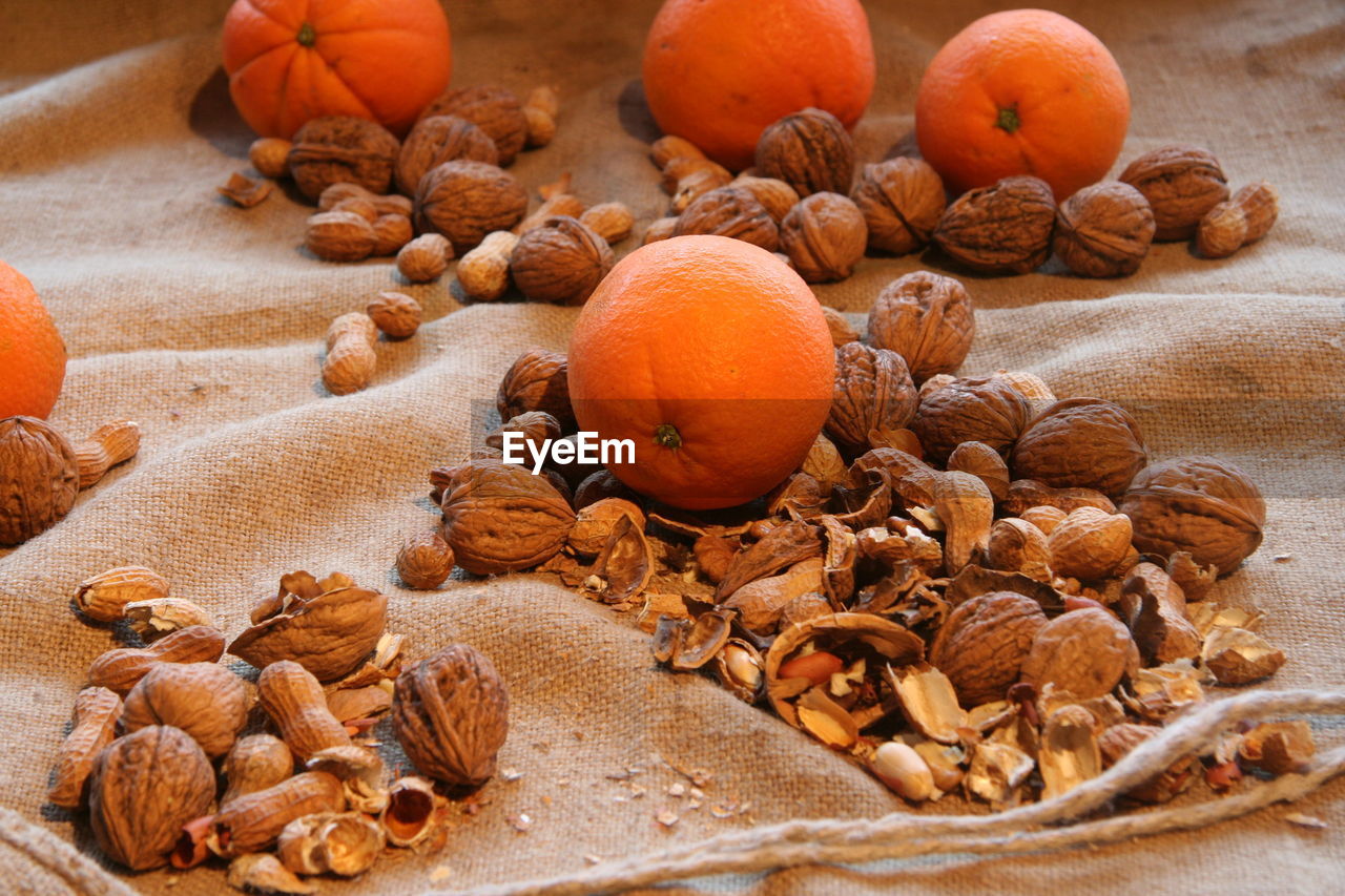 Close-up of oranges and walnuts, christmas theme