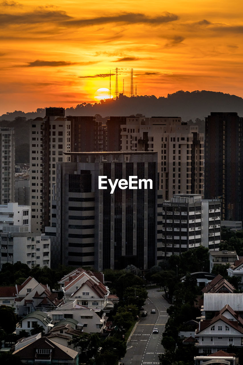 Cityscape against sky during sunset