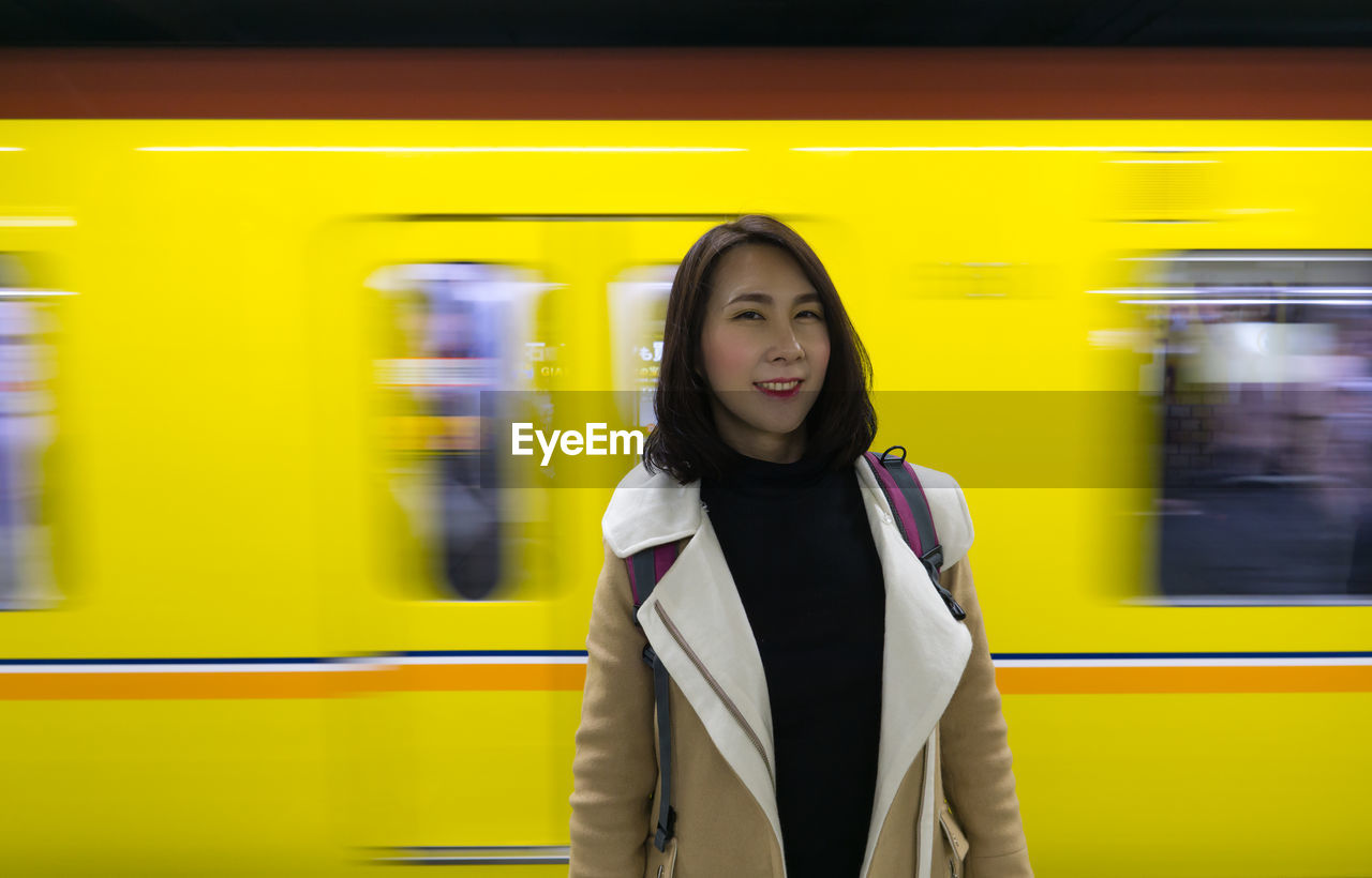 Irene in the station with train background