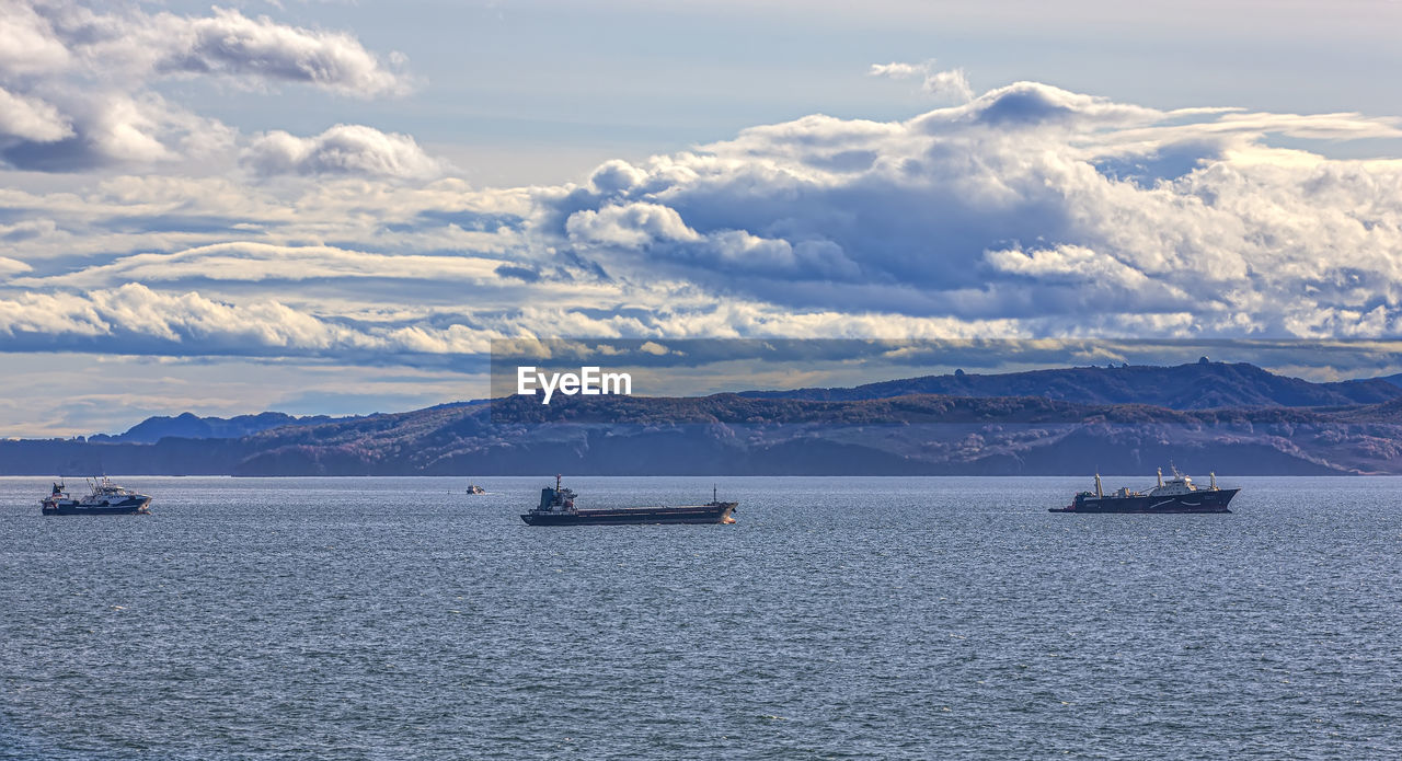 Fishing seiners and cargo ships in avacha bay in kamchatka peninsula