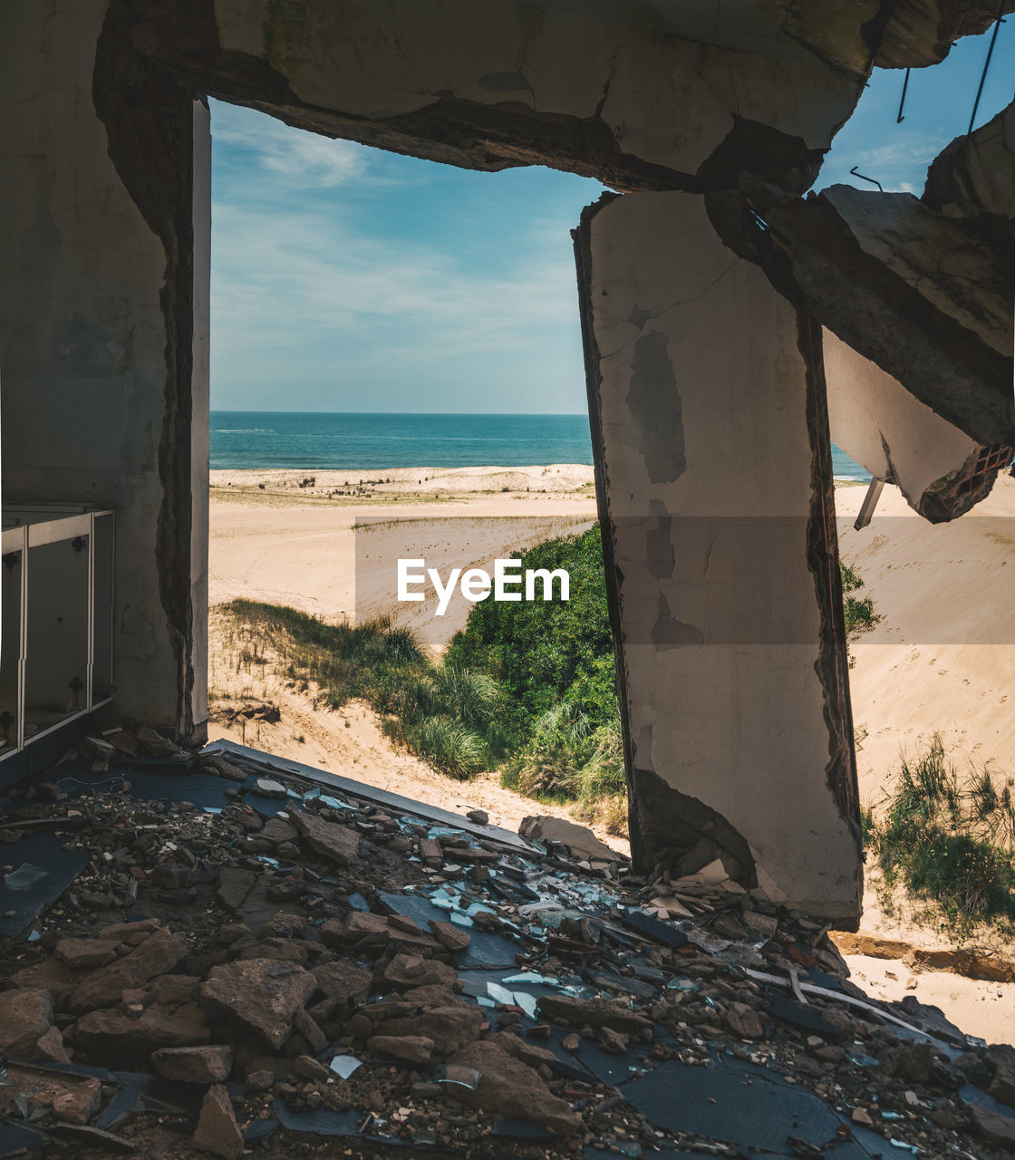 Sea seen through abandoned building