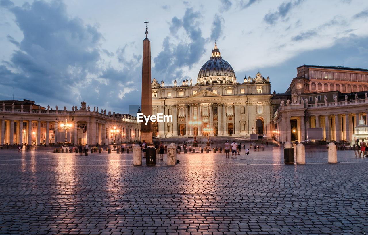 St peters basilica against sky in city at dusk