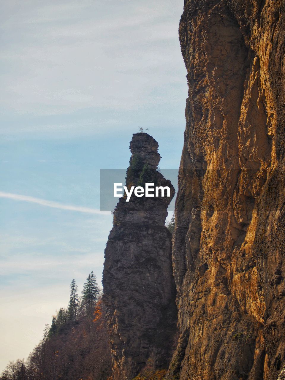 rock, mountain, rock formation, nature, scenics - nature, cliff, beauty in nature, sky, land, tranquility, no people, non-urban scene, travel destinations, environment, landscape, day, geology, tranquil scene, outdoors, travel, cloud, terrain, plant, tree, physical geography, formation, remote