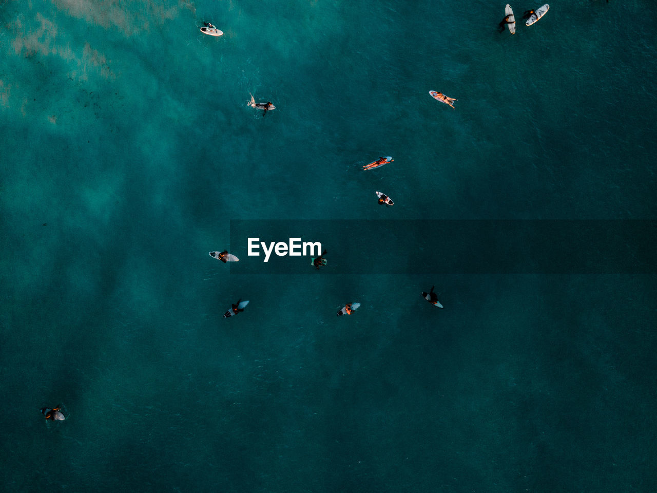 HIGH ANGLE VIEW OF PEOPLE ON SEA