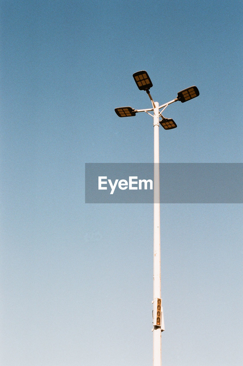 Low angle view of street light against clear sky