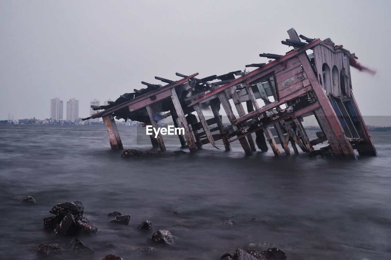 Abandoned built structure in sea