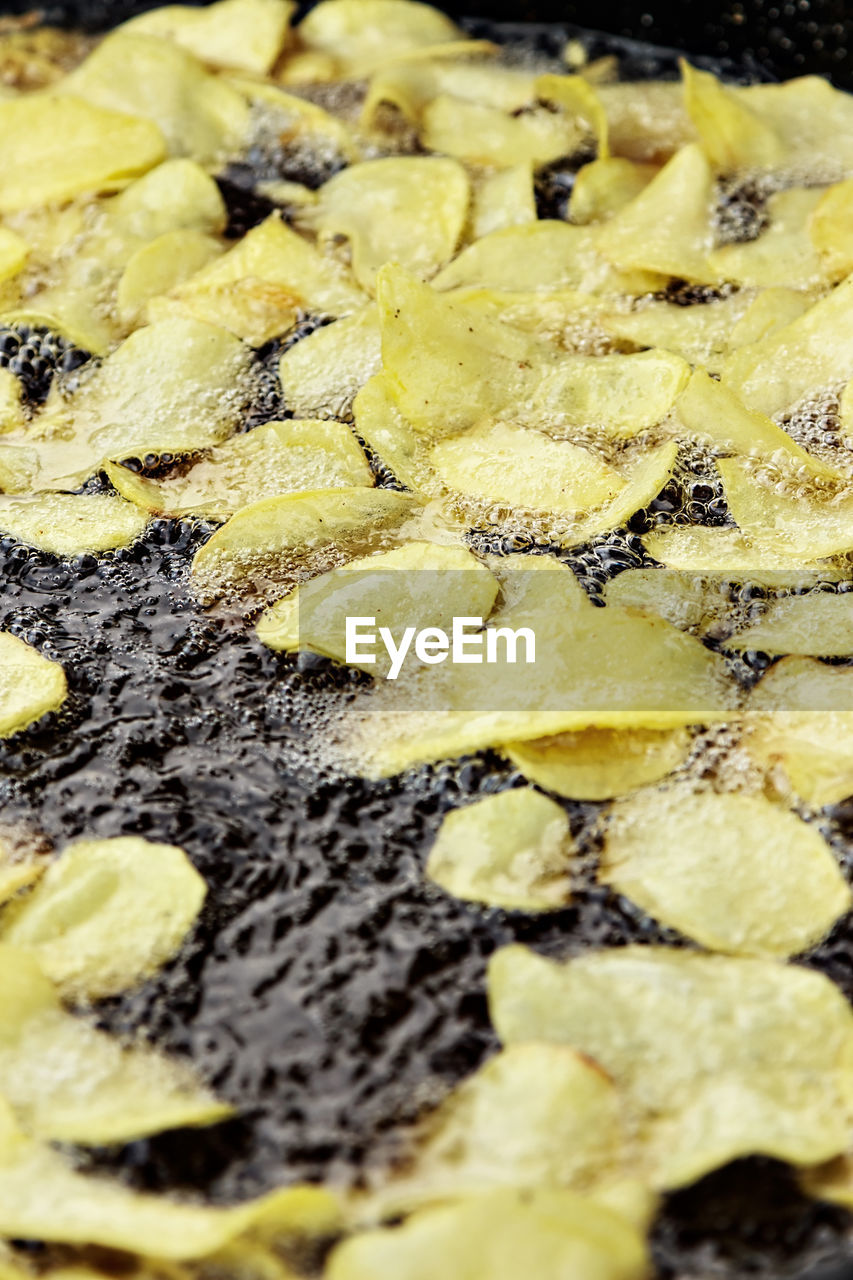 Traditional frying potatoes in a craftsman image.