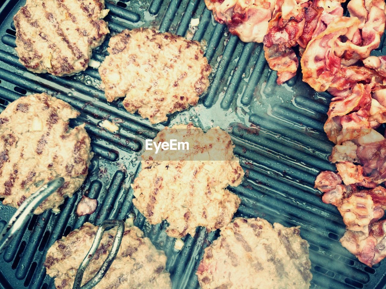 High angle view of meat being grilled on barbecue