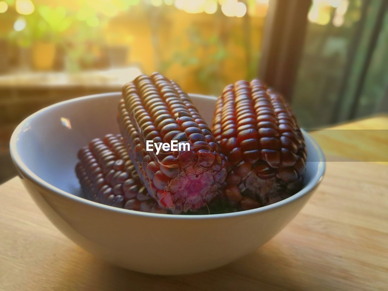 Close-up of sweet purple corn
 in bowl on table