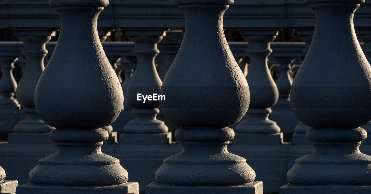 Close-up of baluster in church on sunny day