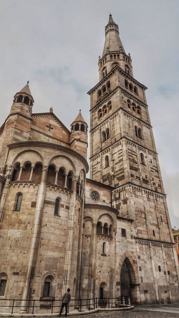 Low angle view of modena cathedral against sky