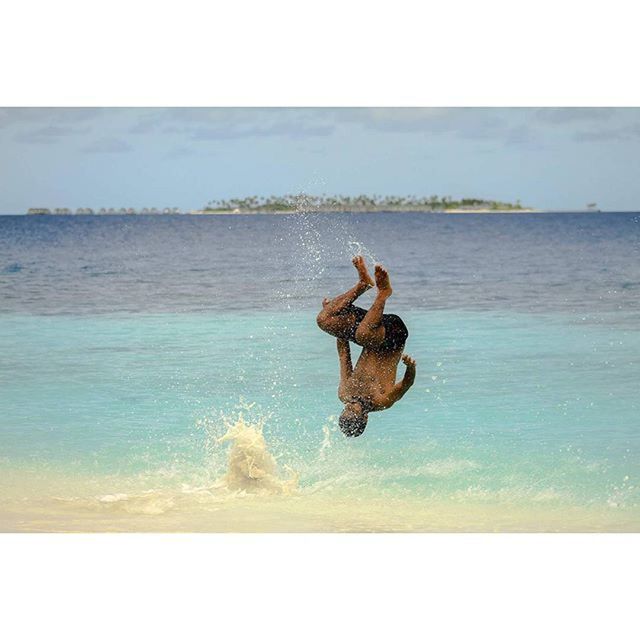 WOMAN SWIMMING IN SEA