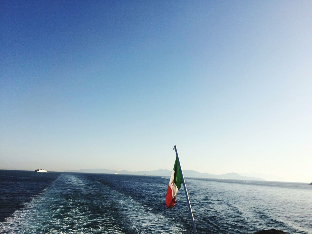 Italian flag against sea
