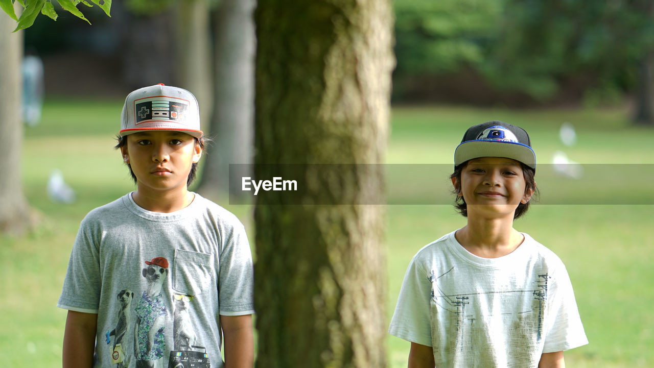 Portrait of brothers at park