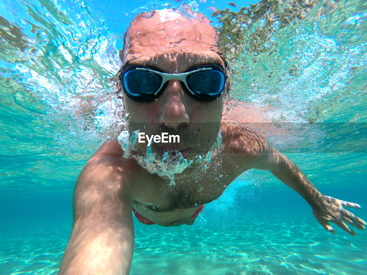 Portrait of man swimming in sea