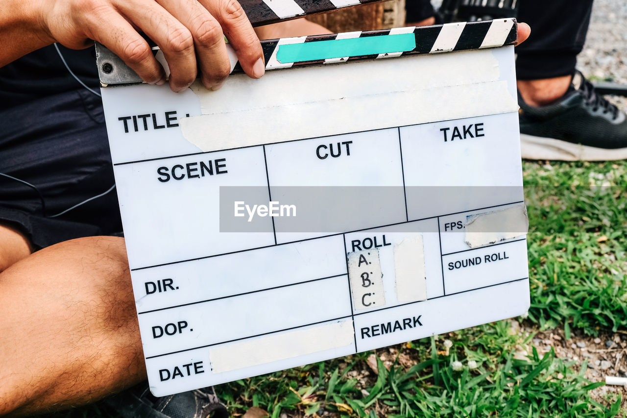 Film slate, close up image of film production crew holding film slate on set