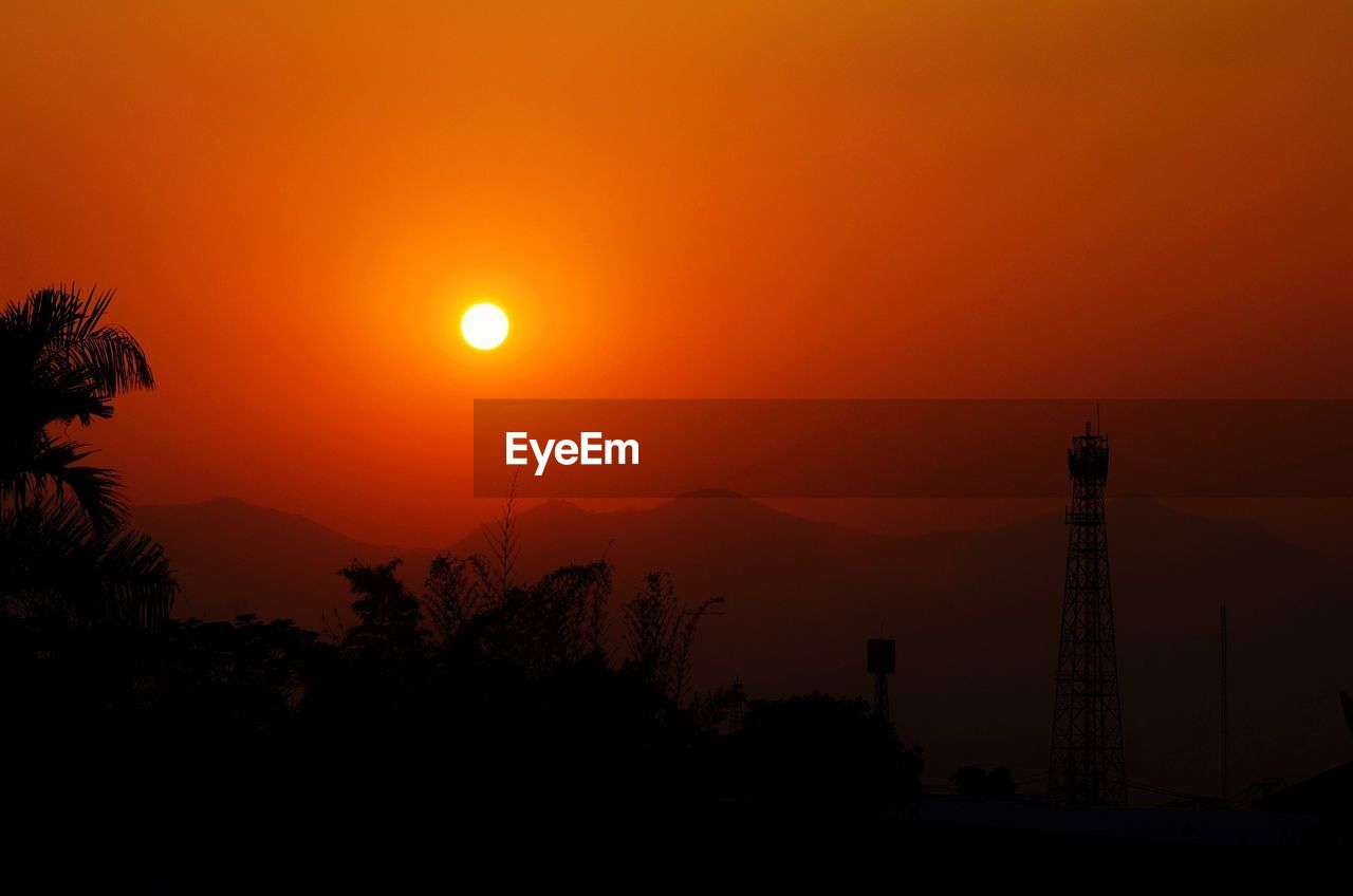 Scenic view of silhouette mountains against sky during sunset