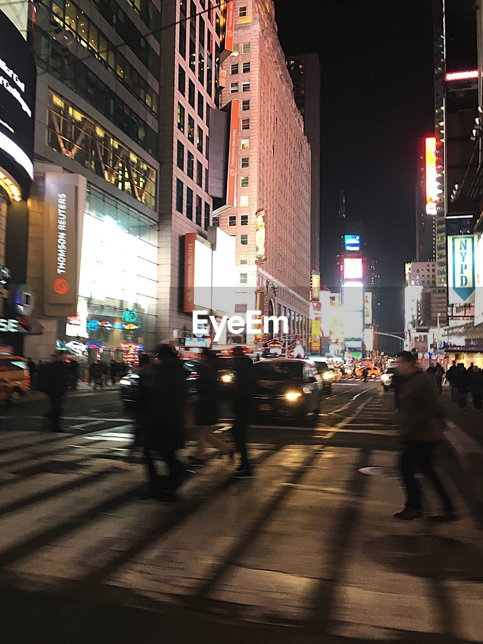 VIEW OF CITY STREET AT NIGHT