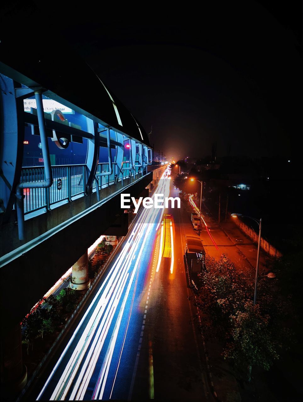 High angle view of light trails on road at night