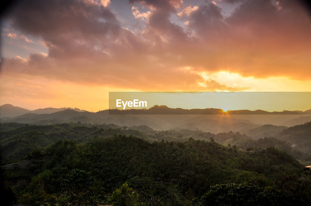 Scenic view of mountains against sky during sunset