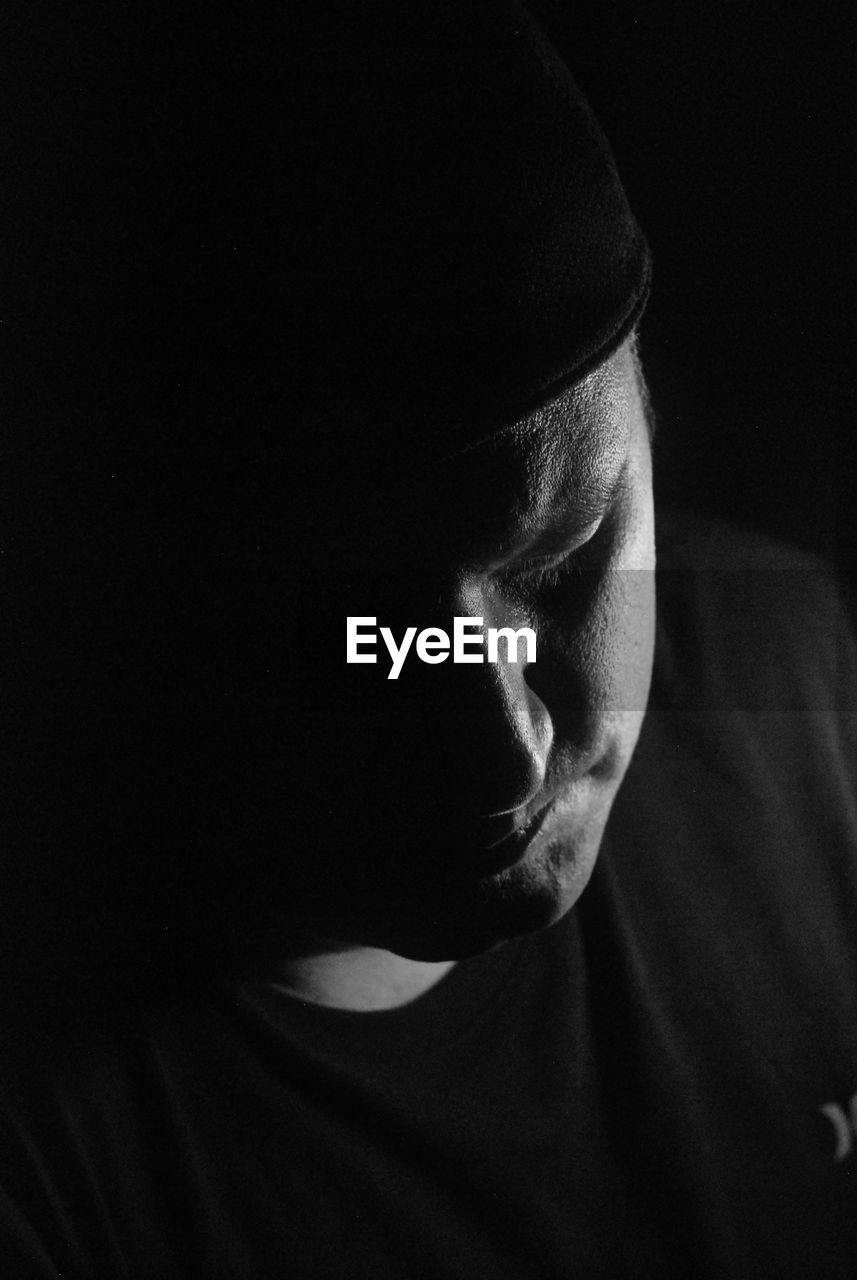 Portrait of young man in darkroom