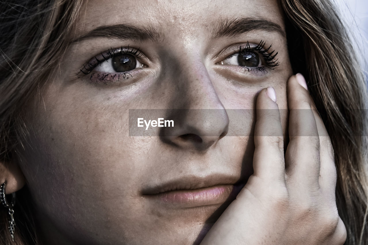 Close-up of girl face looking away