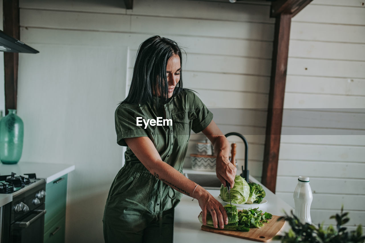 Woman looking at camera at home