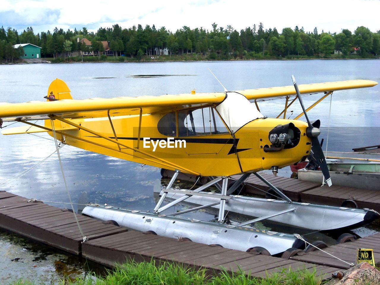 YELLOW BOAT MOORED AT AIRPORT