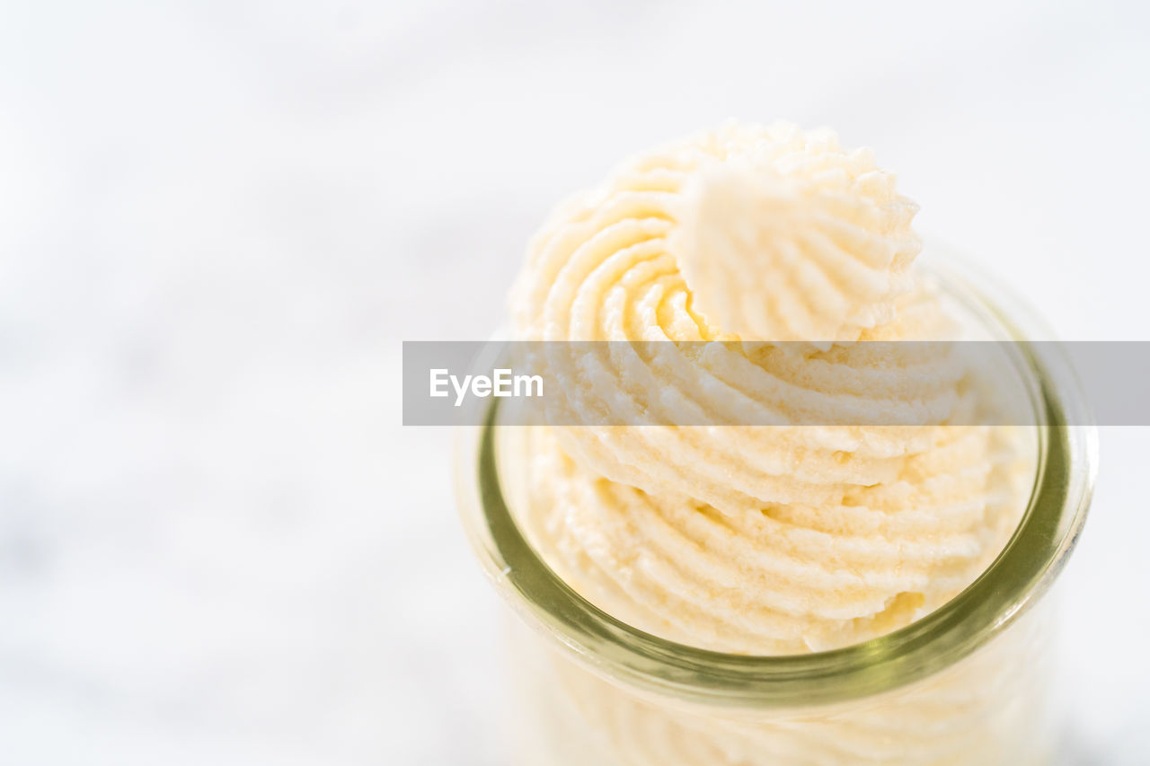 close-up of ice cream in glass on white background