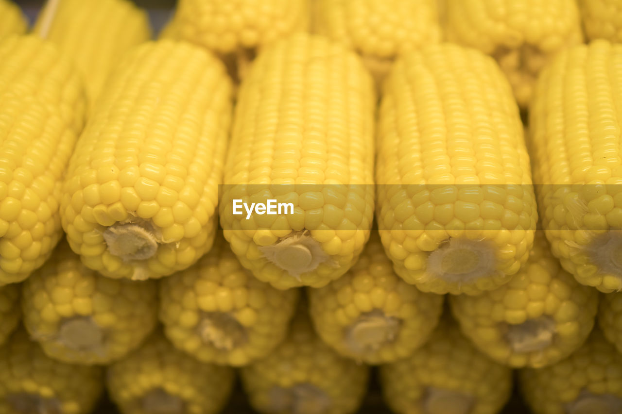 FULL FRAME SHOT OF YELLOW ONIONS FOR SALE