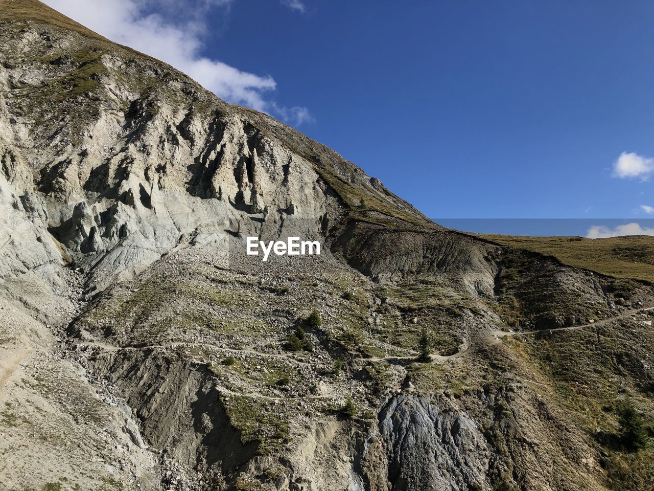 Low angle view of rock formations against sky