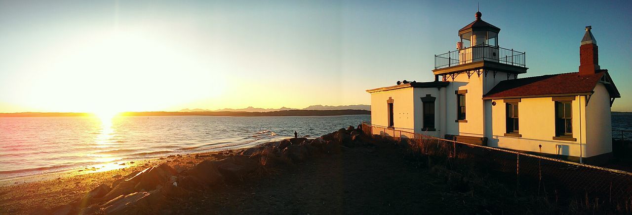 Panoramic view of historic lighthouse at sunset