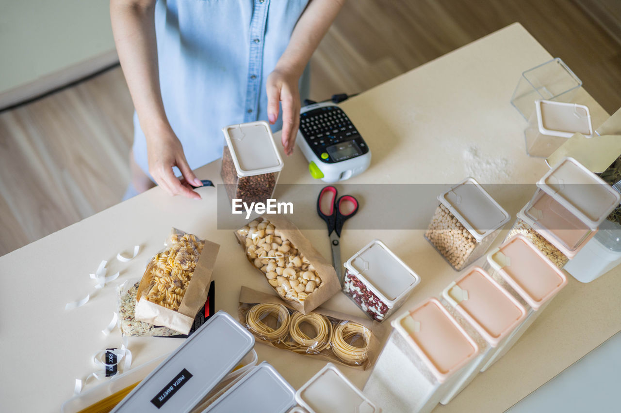 High angle view of woman preparing food on table