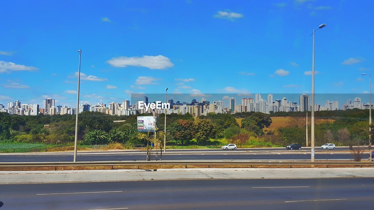 VIEW OF ROAD AGAINST BLUE SKY