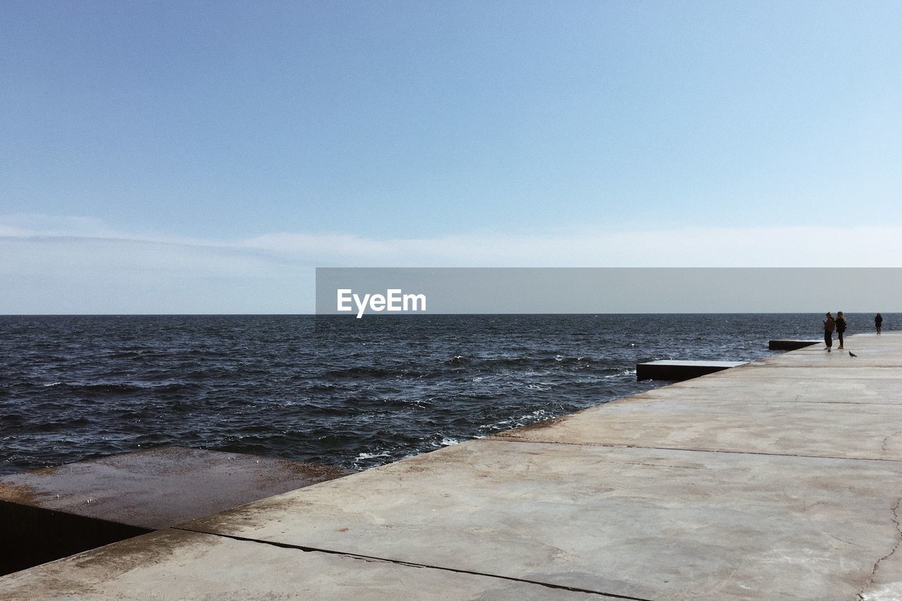 SCENIC VIEW OF SEA BY BEACH AGAINST SKY