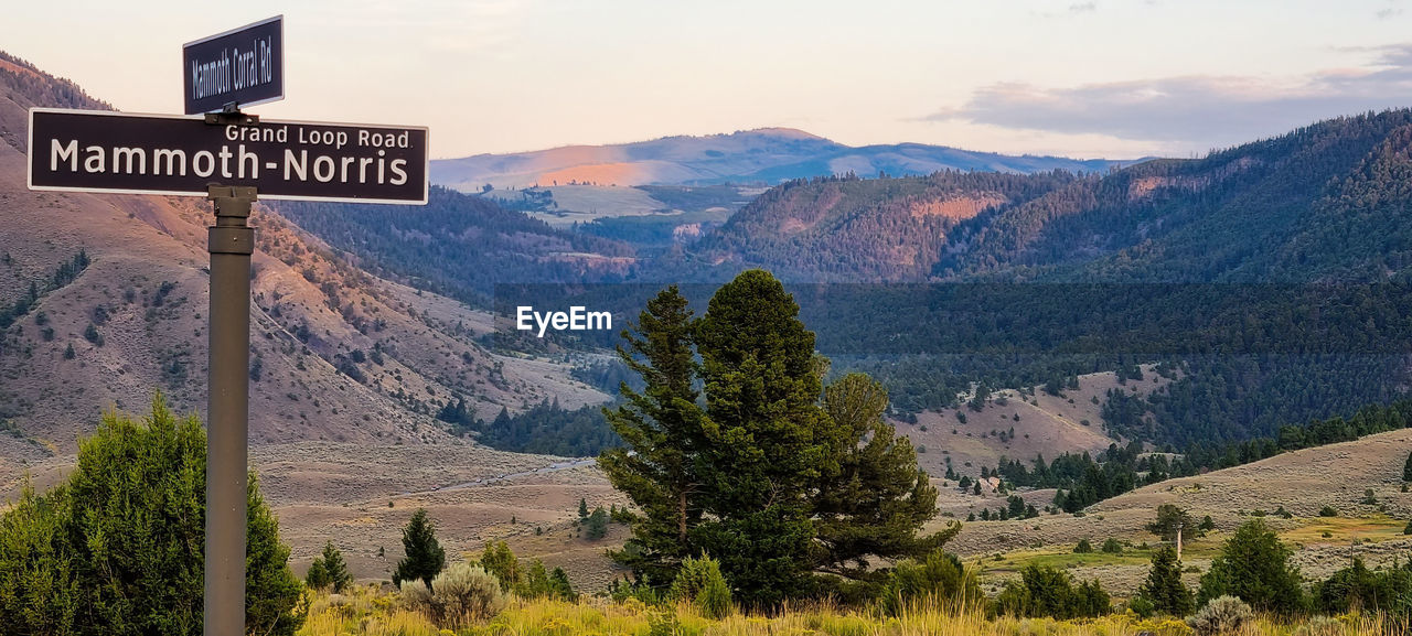 SCENIC VIEW OF MOUNTAINS AND LANDSCAPE AGAINST SKY