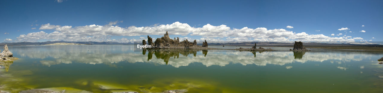 Panoramic view of lake against cloudy sky