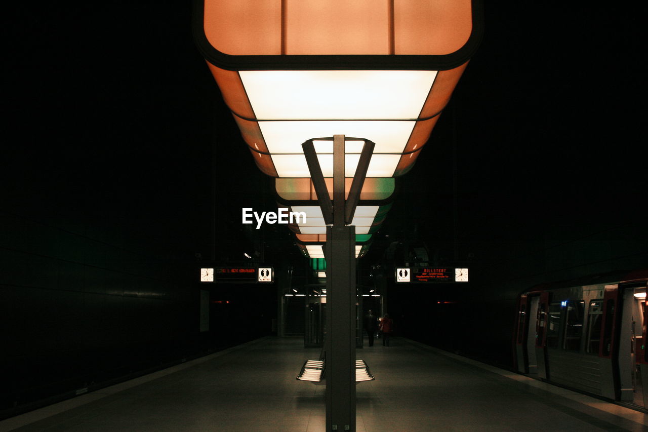 Illuminated railroad station at night