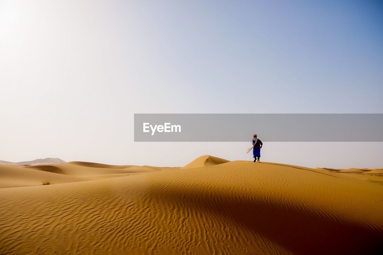 Scenic view of desert against clear sky