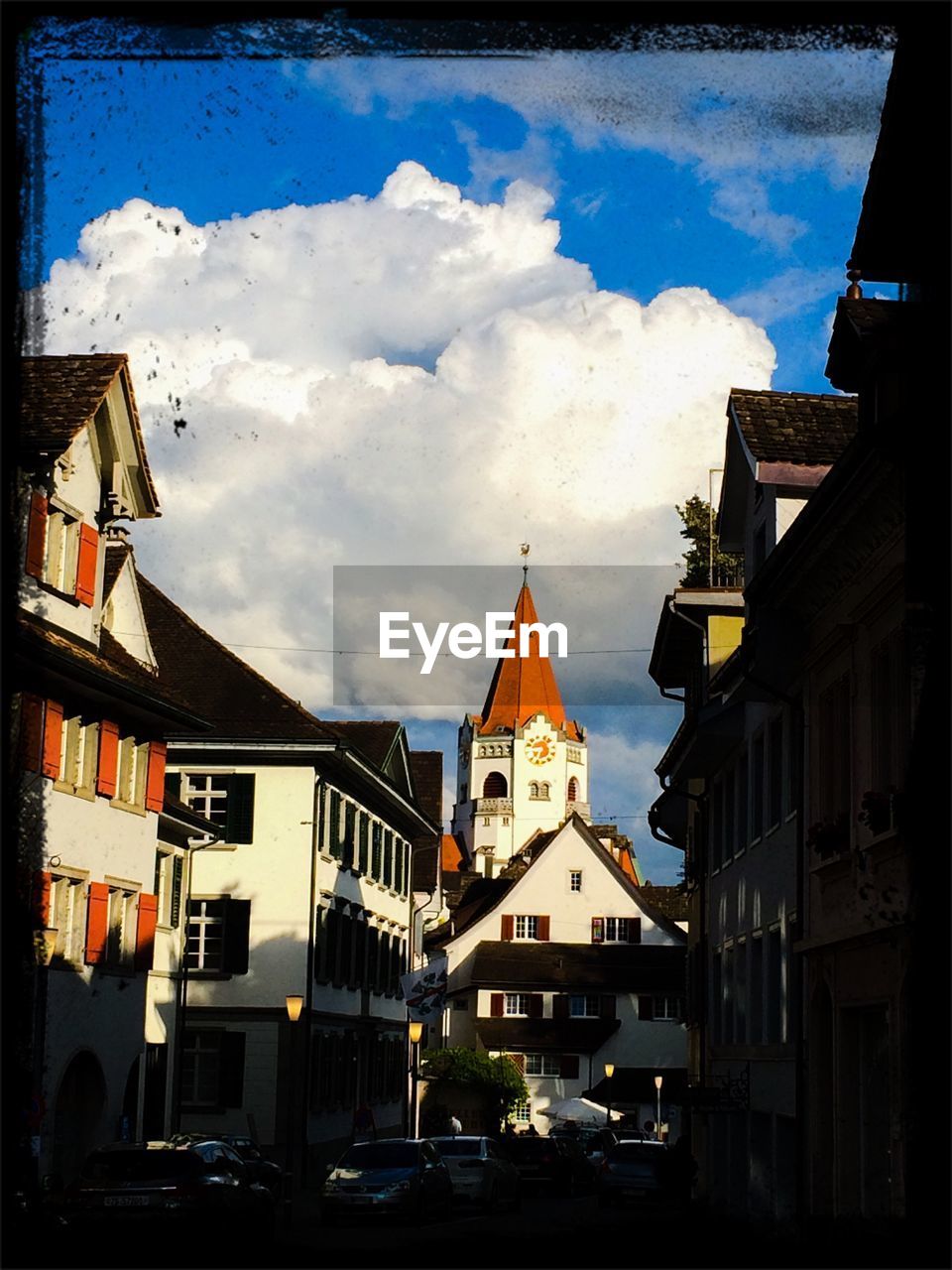 Low angle view of buildings against clouds