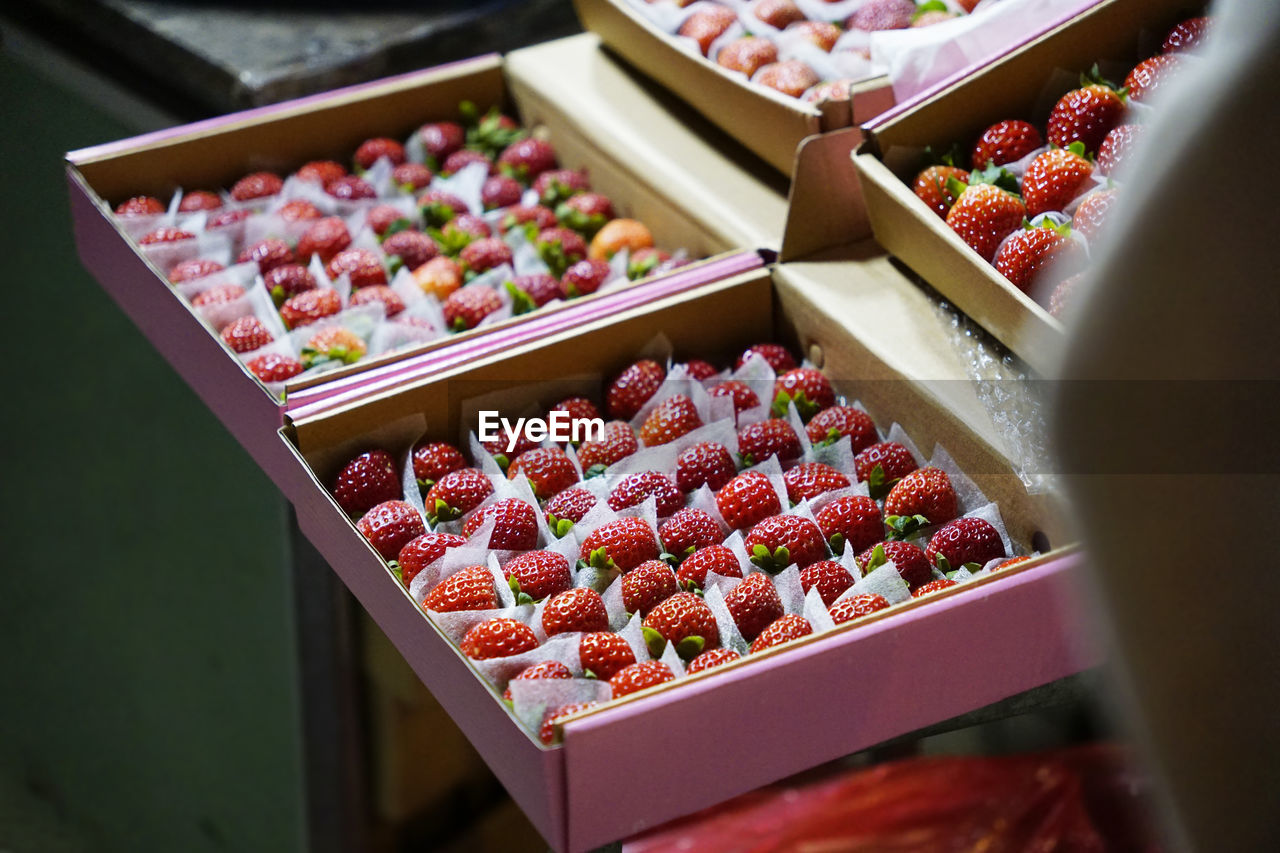 Fresh strawberries in boxes sold at a night market